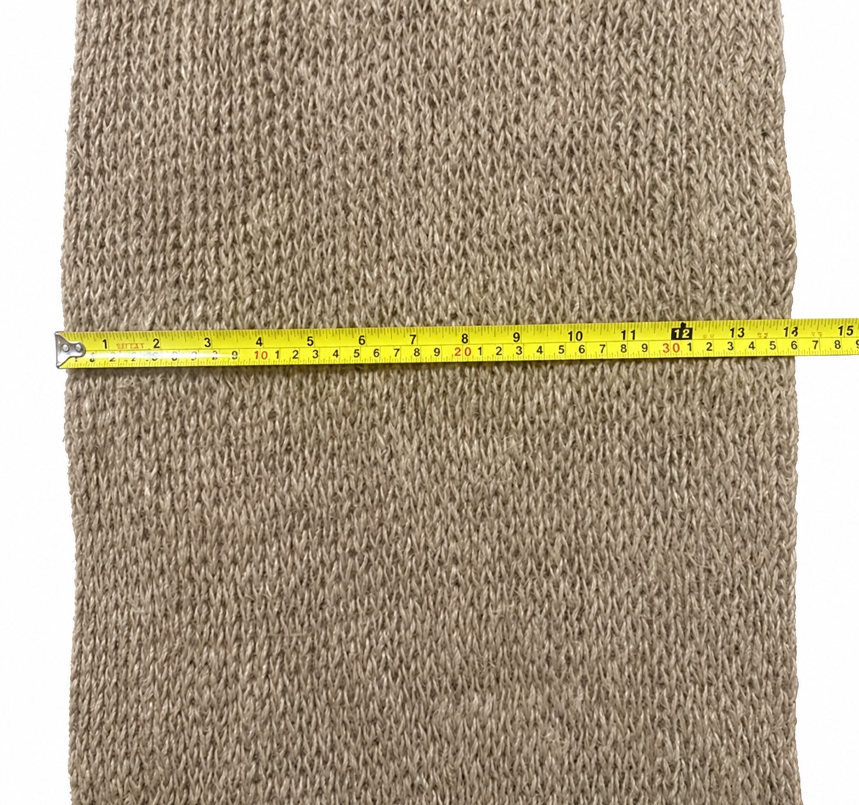 Ninety7 knitted jute netting shown with a tape measure